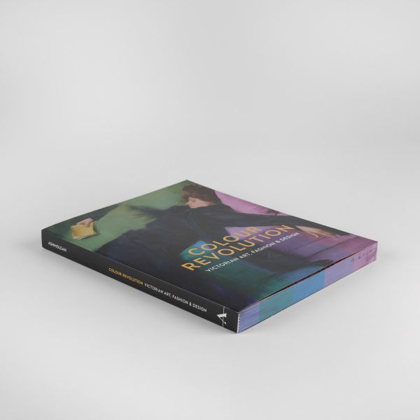 Book cover of Colour Revolution, Victorian Art, Fashion & Design, with a painting titled 'Decadent Young Woman after the Dance' with women in Victorian black dress, laying on green cushions. Published by Ashmolean Museum.