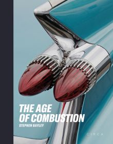 Book cover of The Age of Combustion, Notes on Automobile Design, featuring a close up of duel rear lights of blue Cadillac. Published by Circa Press.