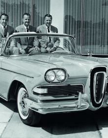 Book cover of The Age of Combustion, Notes on Automobile Design, featuring a close up of duel rear lights of blue Cadillac. Published by Circa Press.