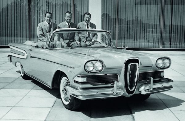 Book cover of The Age of Combustion, Notes on Automobile Design, featuring a close up of duel rear lights of blue Cadillac. Published by Circa Press.