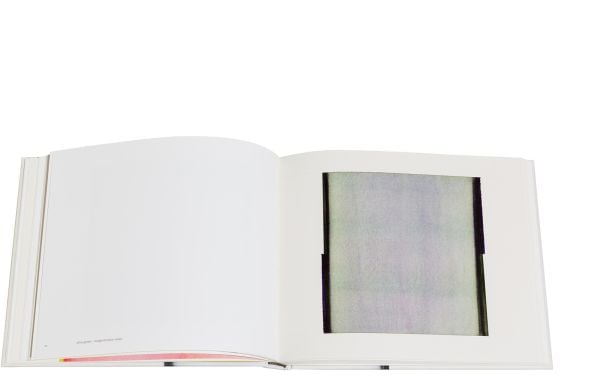 Vertical bleeding black paint line to centre of cream cover of 'Callum Innes – a pure land', by Circa Press.