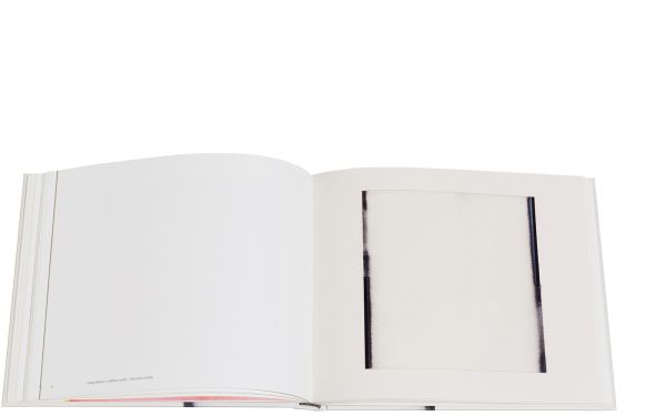 Vertical bleeding black paint line to centre of cream cover of 'Callum Innes – a pure land', by Circa Press.