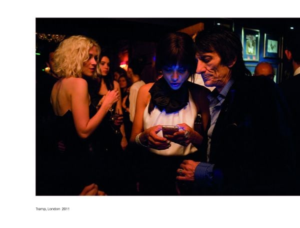 Group of women looking at their mobile phones, their faces illuminated, on cover of 'Screen Time', by Circa Press.