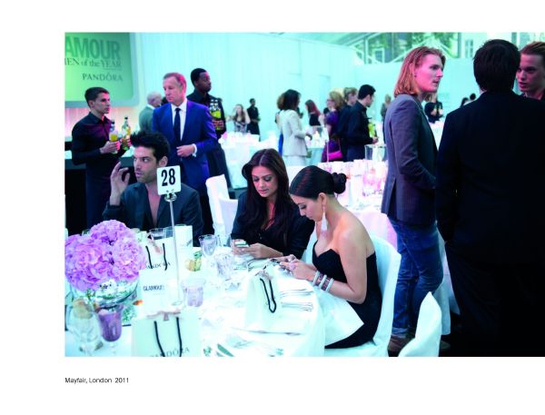 Group of women looking at their mobile phones, their faces illuminated, on cover of 'Screen Time', by Circa Press.