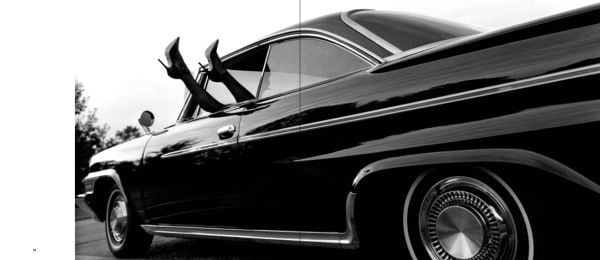 Model in black bandeau dress and sunglasses, lying on black car, on cover of 'Alejandra Guerrero - Auto Erotica', by Circa Press.