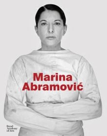 Book cover of art exhibition catalogue of Marina Abramovi?, featuring the Serbian artist in straight-jacket, staring sternly at the viewer. Published by Royal Academy of Arts.