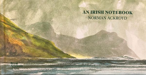 Book cover of Norman Ackroyd: An Irish Notebook, featuring a watercolour of rugged coastline, with silhouettes of rocks in foreground. Published by Royal Academy of Arts.