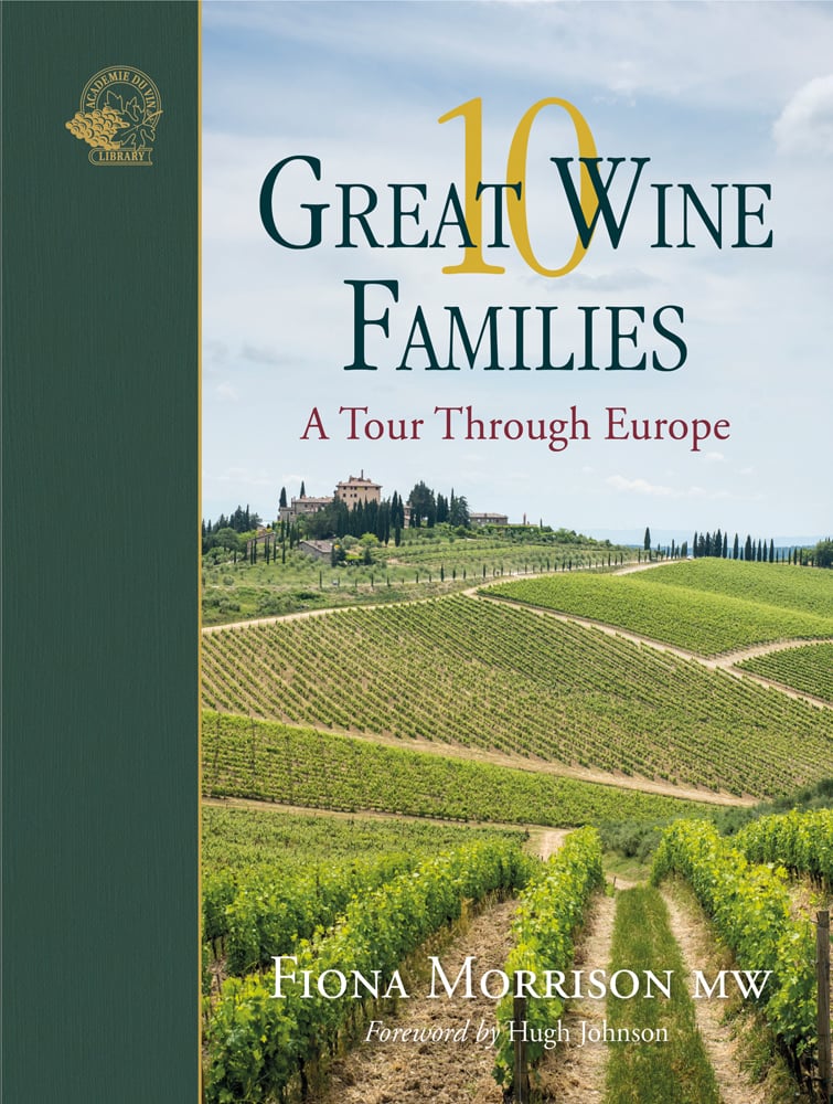 Stunning view of European vineyards with building in distance, on cover of '10 Great Wine Families, A Tour Through Europe' by Academie du Vin Library.