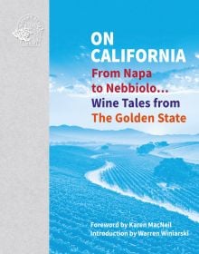 Vineyard with mountainous backdrop, on cover of 'On California, From Napa to Nebbiolo… Wine Tales from the Golden State', by Academie du Vin Library.