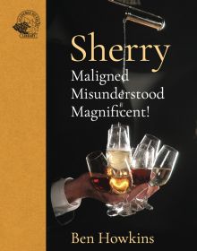 Bartender's hand elegantly grasps 8 sherry glasses and pours liquid into them from height on cover of 'Sherry, Maligned*Misunderstood*Magnificent!', by Academie du Vin Library.