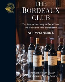 Bottles of vintage red wine on table, with wine glasses, on cover of 'The Bordeaux Club, The convivial adventures of 12 friends and the world's finest wine', by Academie du Vin Library.