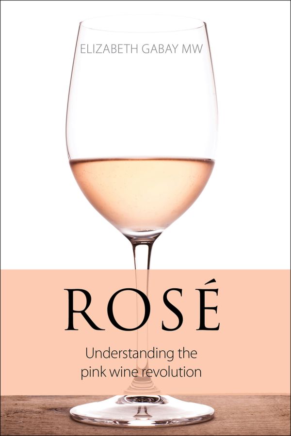 Book cover of Elizabeth Gabay's Rosé, Understanding the Pink Wine Revolution, with a wine glass of Rose on table. Published by Academie du Vin Library.