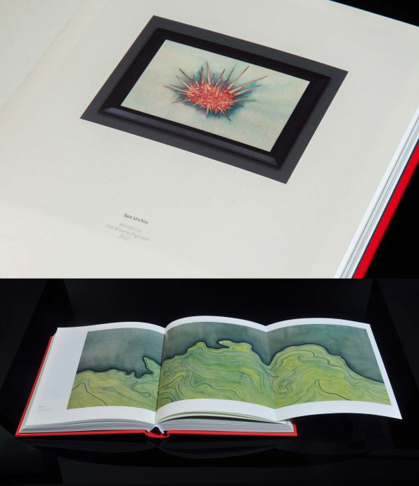 Book cover of Chen Duxi's Between Earth And Heaven, with pink magnolia flower on end of branch. Published by Artpower International.