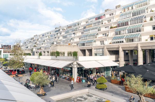 Book cover of Jack Young's The Council House, with Tower block with pebble-dash sections and frosted glass panels showing staircase. Published by Hoxton Mini Press.
