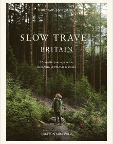 Book cover of Liz Schaffer's Slow Travel Britain, with hiker in middle of forest looking up. Published by Hoxton Mini Press.