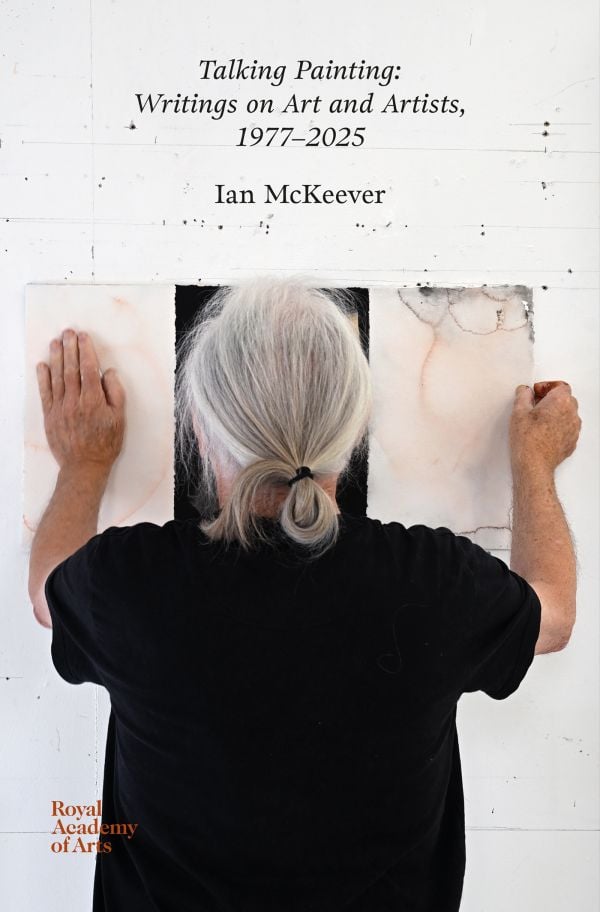 Book cover of Talking Painting: Writings on Art and Artists, 1977–2025: Ian McKeever; featuring artist facing away from the viewer, hanging a piece of work on wall. Published by Royal Academy of Arts.