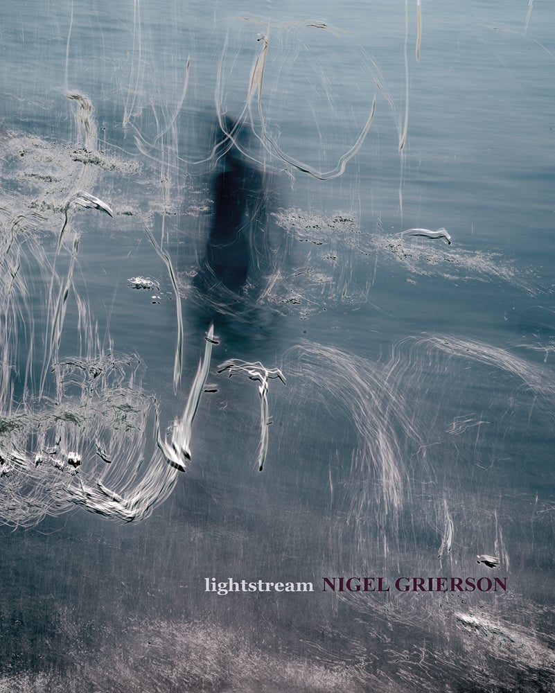 Pale blue and white blurred abstract photograph of figure in sea, lightstream NIGEL GRIERSON in white and purple font below.