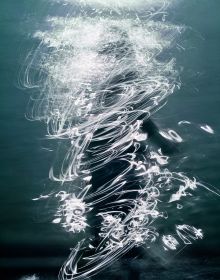 Pale blue and white blurred abstract photograph of figure in sea, on cover of 'Lightstream', by Lost Press.