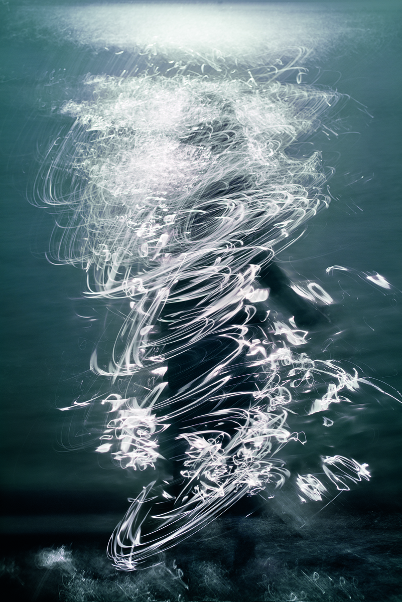 Pale blue and white blurred abstract photograph of figure in sea, on cover of 'Lightstream', by Lost Press.