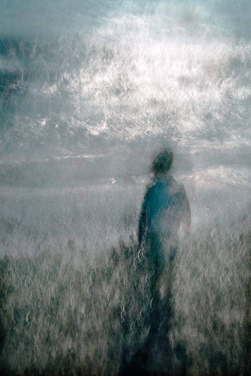 Pale blue and white blurred abstract photograph of figure in sea, on cover of 'Lightstream', by Lost Press.