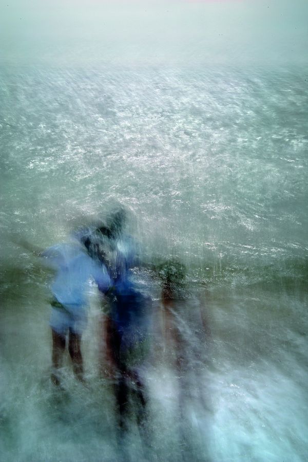 Pale blue and white blurred abstract photograph of figure in sea, on cover of 'Lightstream', by Lost Press.