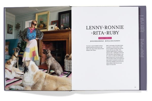 Book cover of Georgina Montagu's Top Dogs: A British Love Affair, with a castle guard in purple coat standing with an Irish wolfhound. Published by Triglyph Books.