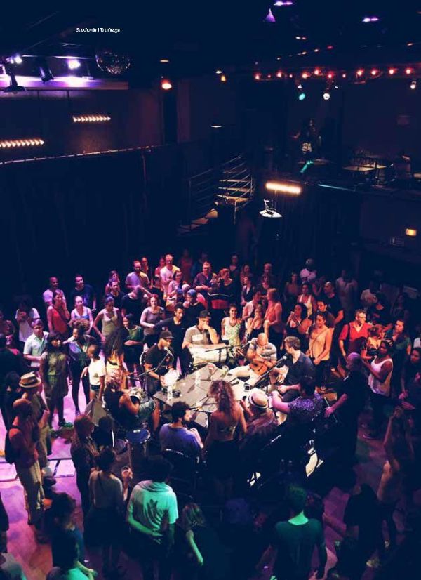 Book cover of Don't be a Tourist in Paris. with an aerial view of red stairs leading down to black and white checked tiled floor. Published by 13 Things Ltd.