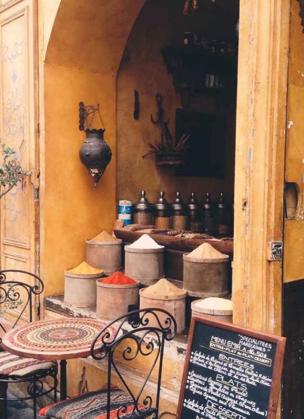 Book cover of Don't be a Tourist in Paris. with an aerial view of red stairs leading down to black and white checked tiled floor. Published by 13 Things Ltd.