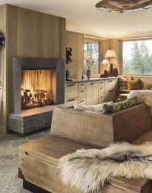 Book cover of Stories of Home: Residential Designs by Hacin; showcasing a modern living room with a fireplace, contemporary lighting, and warm-toned furnishings. Published by Images Publishing.
