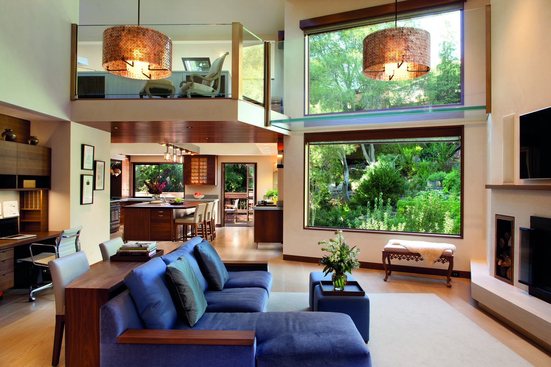 Single storey wood house with low steps leading to swimming pool, Pacific Modern in white font above