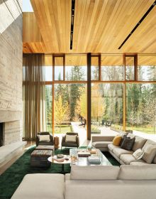 Contemporary flat roof building near lake and autumn trees, Inspired by Place Architects CLB in brown font above by Oro Editions.