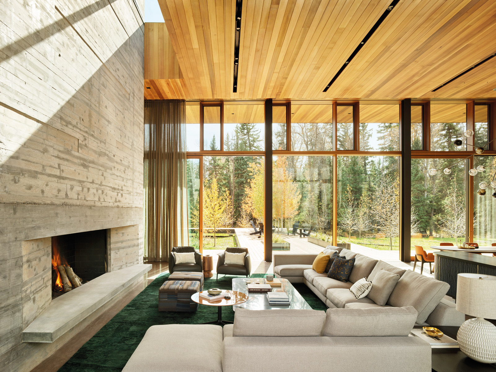 Contemporary flat roof building near lake and autumn trees, Inspired by Place Architects CLB in brown font above by Oro Editions.