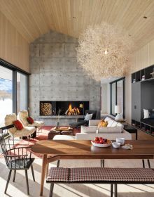 Contemporary flat roof building near lake and autumn trees, Inspired by Place Architects CLB in brown font above by Oro Editions.