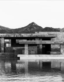 Low angled shot of interior building, Emre Arolat Scent of the Trace in white font above.