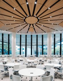 2 lines of white globe lighting fixtures attached to v-shaped chrome fittings, black cover, DP DESIGN DESIGNING CHANGE in white font below.