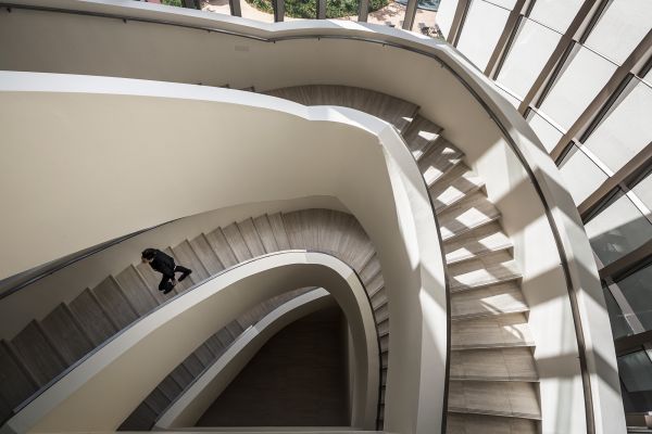 2 lines of white globe lighting fixtures attached to v-shaped chrome fittings, black cover, DP DESIGN DESIGNING CHANGE in white font below.