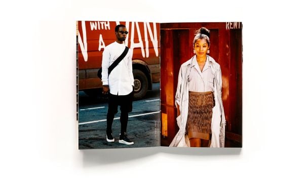 Black skinned woman in peplum top and glasses, high style dreadlocks, Street Culture in white font below