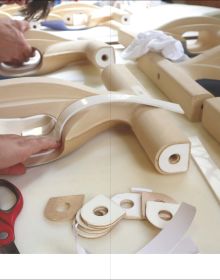 Grey and blue tile edges with Architectural Ceramic Assemblies Workshop in white font to top right