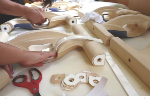 Grey and blue tile edges with Architectural Ceramic Assemblies Workshop in white font to top right