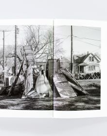 Book cover of Mise-en-Scène The Lives and Afterlives of Urban Landscapes, with a vast American urban landscape, with skeletal trees in foreground. Published by ORO Editions.