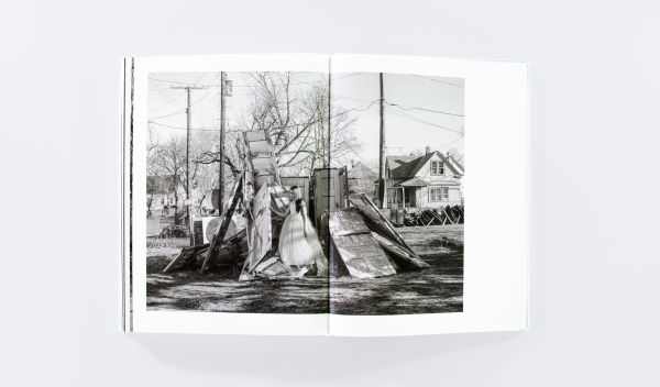 Book cover of Mise-en-Scène The Lives and Afterlives of Urban Landscapes, with a vast American urban landscape, with skeletal trees in foreground. Published by ORO Editions.
