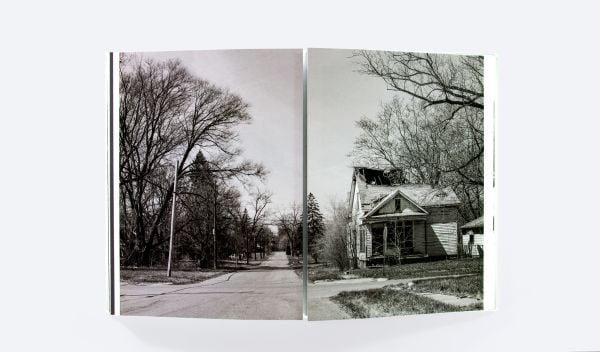 Book cover of Mise-en-Scène The Lives and Afterlives of Urban Landscapes, with a vast American urban landscape, with skeletal trees in foreground. Published by ORO Editions.