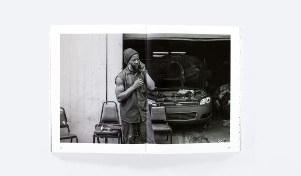 Book cover of Mise-en-Scène The Lives and Afterlives of Urban Landscapes, with a vast American urban landscape, with skeletal trees in foreground. Published by ORO Editions.