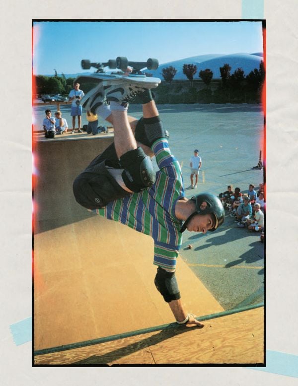 Book cover of Pete Thompson's 93 til, A Photographic Journey Through Skateboarding in the 1990s, with professional skateboarder Stevie Williams sitting on low brick wall smoking cigarette, with his board upside down on lap. Published by ORO Editions.
