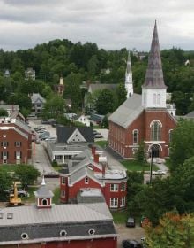 Landscape photograph of American barn with American flag draped across the front, Americana in white font, Mathew Teklusky in blue font on bottom white banner.