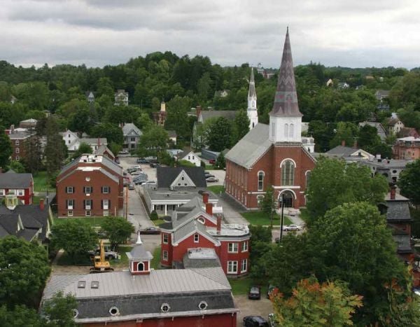 Landscape photograph of American barn with American flag draped across the front, Americana in white font, Mathew Teklusky in blue font on bottom white banner.
