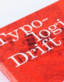 Red cover with orange dots and geometrical patterns with Typological Drift in white font at top