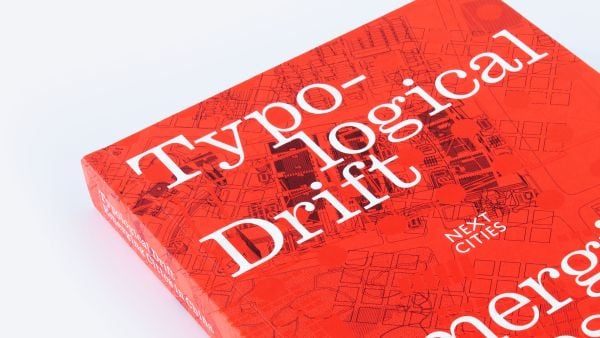 Red cover with orange dots and geometrical patterns with Typological Drift in white font at top