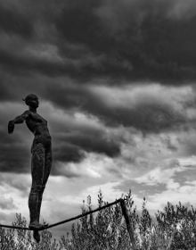 Book cover of Think Before You Shoot, with a man in trilby, sitting in street, holding cup to lips, with old box camera. Published by ORO Editions.