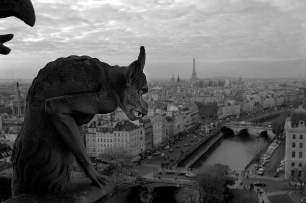 Book cover of Think Before You Shoot, with a man in trilby, sitting in street, holding cup to lips, with old box camera. Published by ORO Editions.